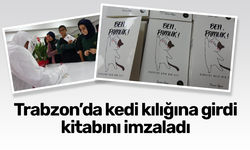 Trabzon'da kedi kılığına girdi kitabını imzaladı