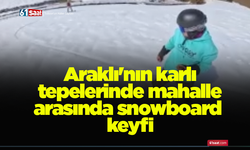 Araklı'nın karlı tepelerinde mahalle arasında snowboard keyfi