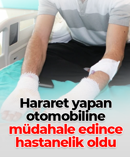 Hararet yapan otomobiline müdahale edince hastanelik oldu