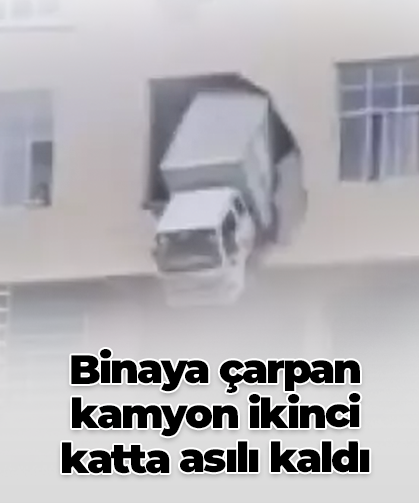Binaya çarpan kamyon ikinci katta asılı kaldı