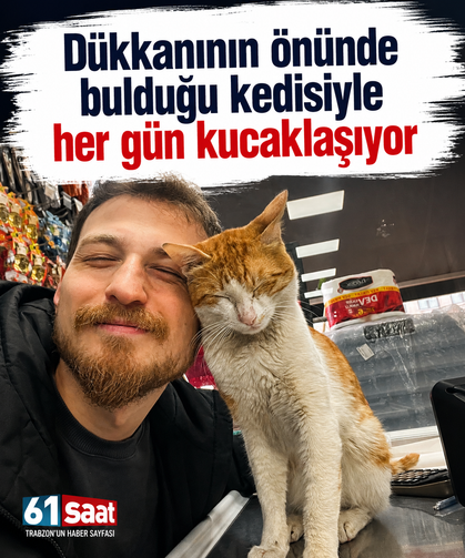 Dükkanının önünde bulduğu kedisiyle her gün kucaklaşıyor