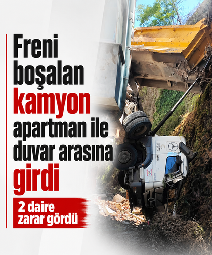 Freni boşalan kamyon apartman ile duvar arasına girdi: 2 daire zarar gördü