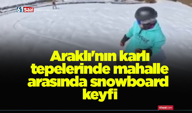 Araklı'nın karlı tepelerinde mahalle arasında snowboard keyfi